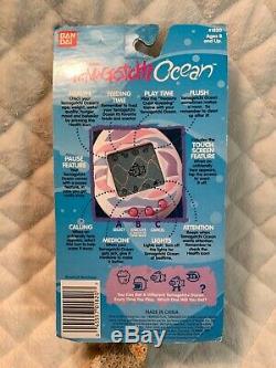 RARE 1997 Bandai Tamagotchi Ocean- Sea Foam Green With Pink Fish New In Package